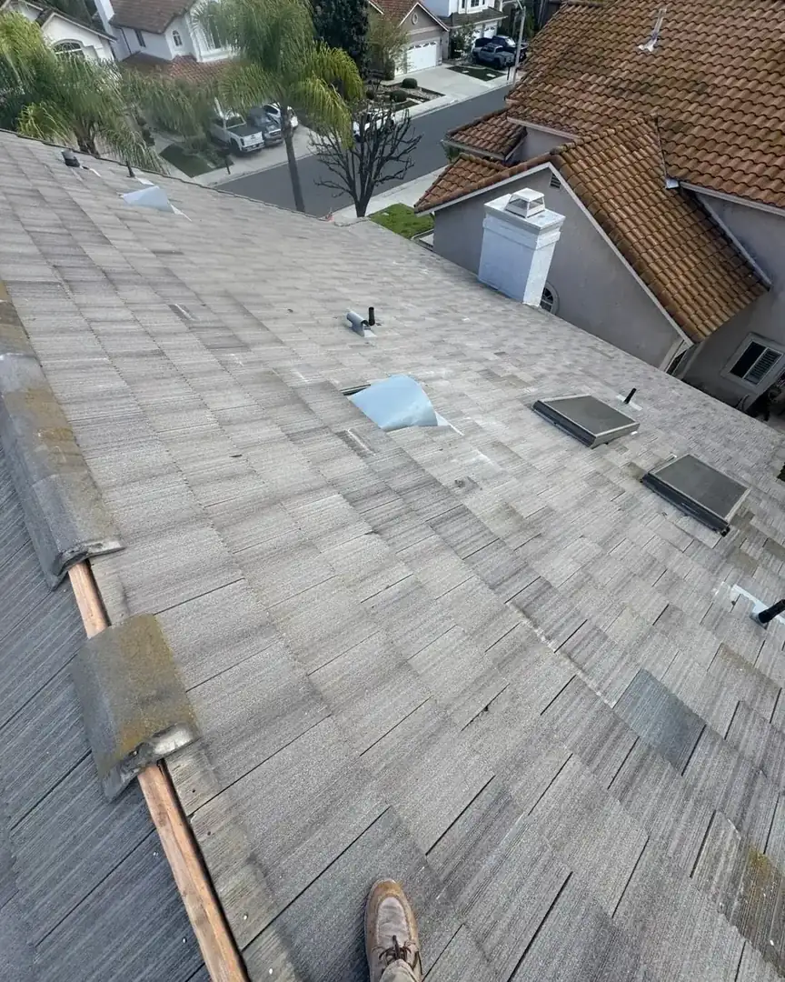 Asphalt shingle roof repair in progress