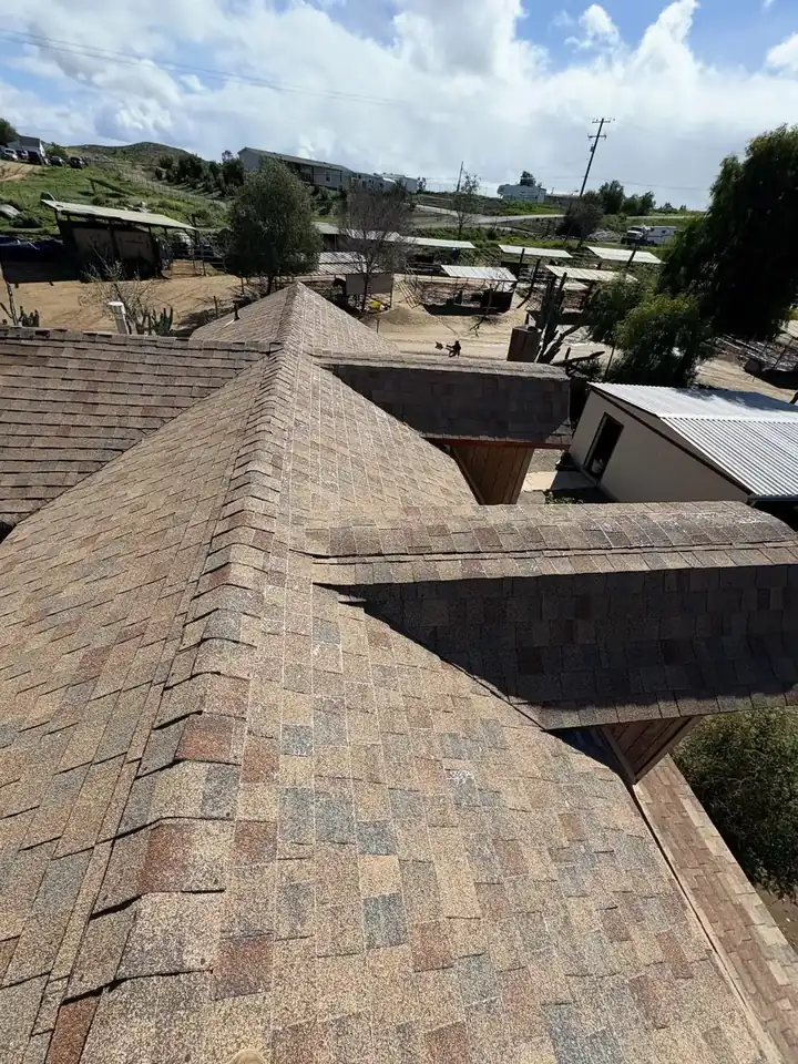 Roofing crew completing a tile roof tune-up